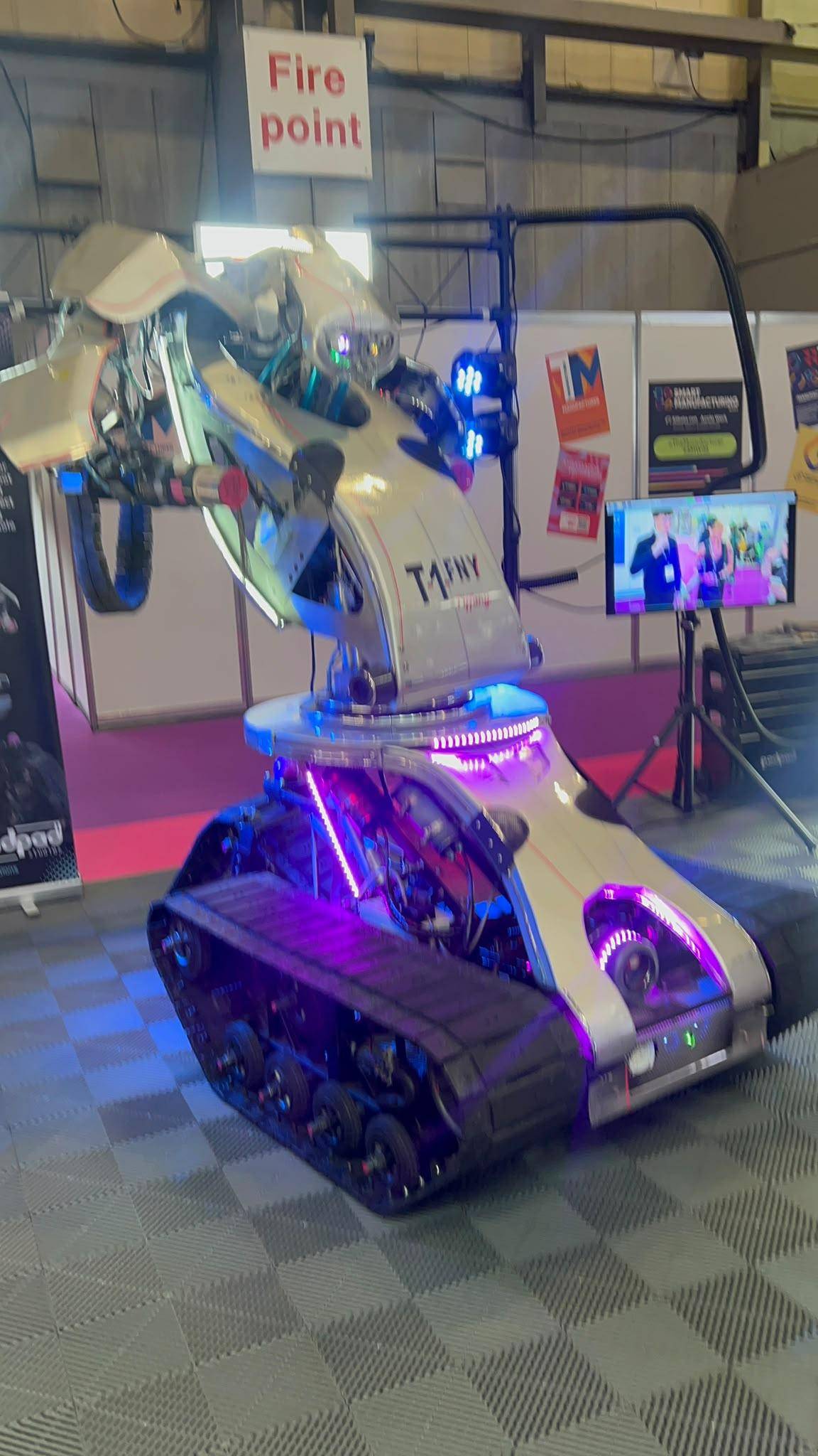 T1NY tracked robot with articulated arm at Smart Manufacturing Week