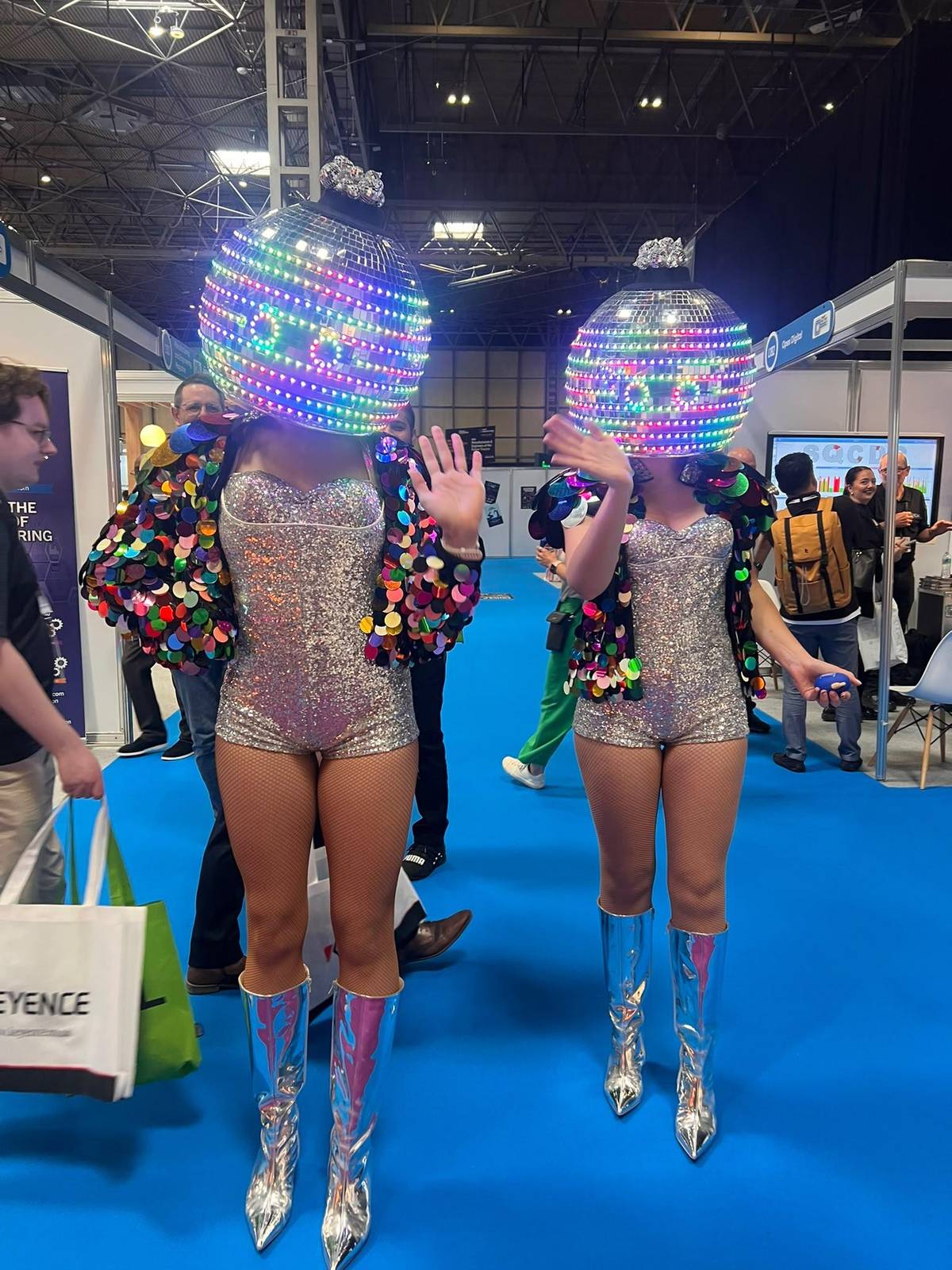 LED disco-ball performers walking the Smart Manufacturing Week show floor