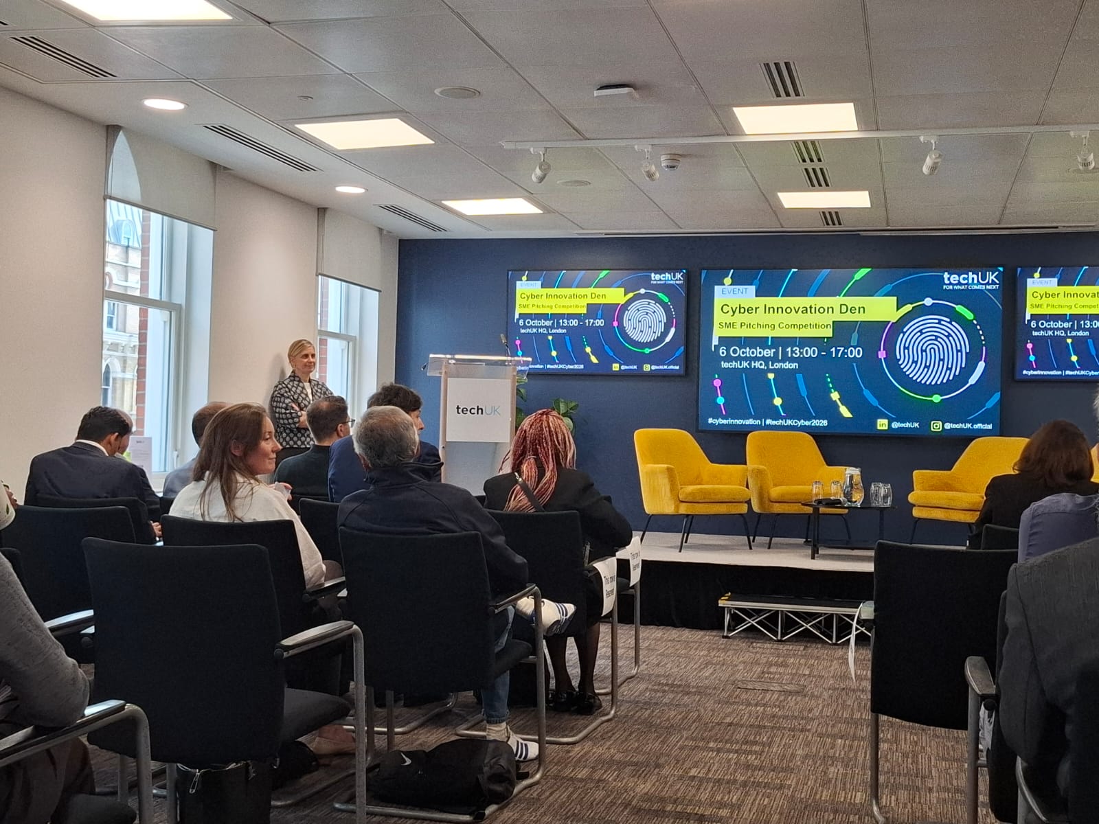 Stage and audience at the techUK Cyber Innovation Den event in London.